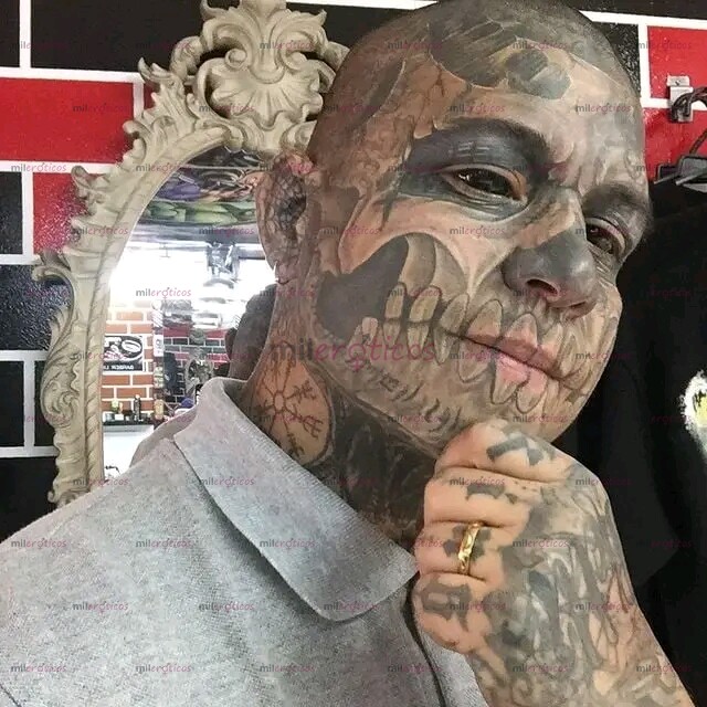 FOTOS DE MACHO DOMINANTE MODIFICADO Y TATUADO DE PIES A CABEZA.