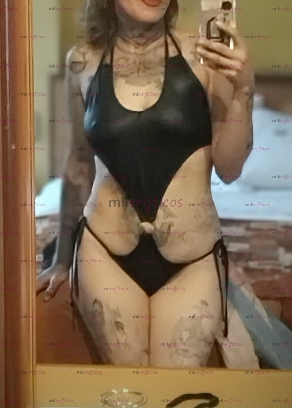 FOTOS DE MADURA, DELGADA, TATUADA Y EXTEOVERTIDA.